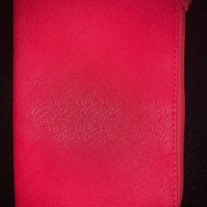 A pink striped clutch